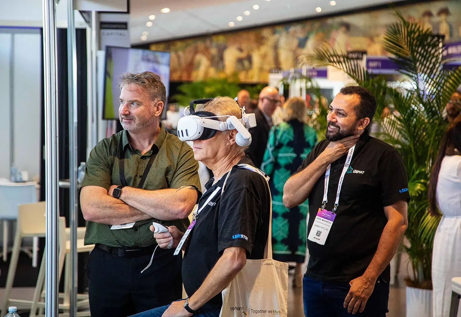 Delegates in conversation at an exhibition stand