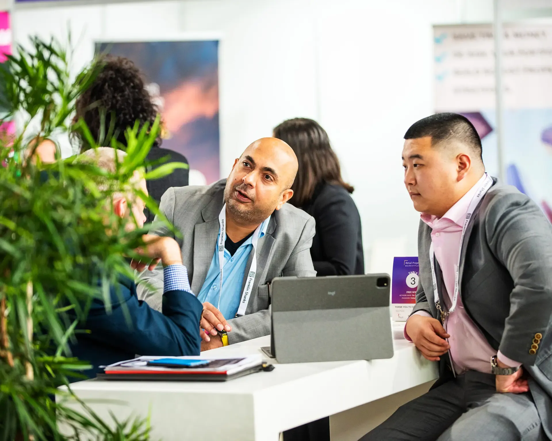 The connexU team in conversation at an event