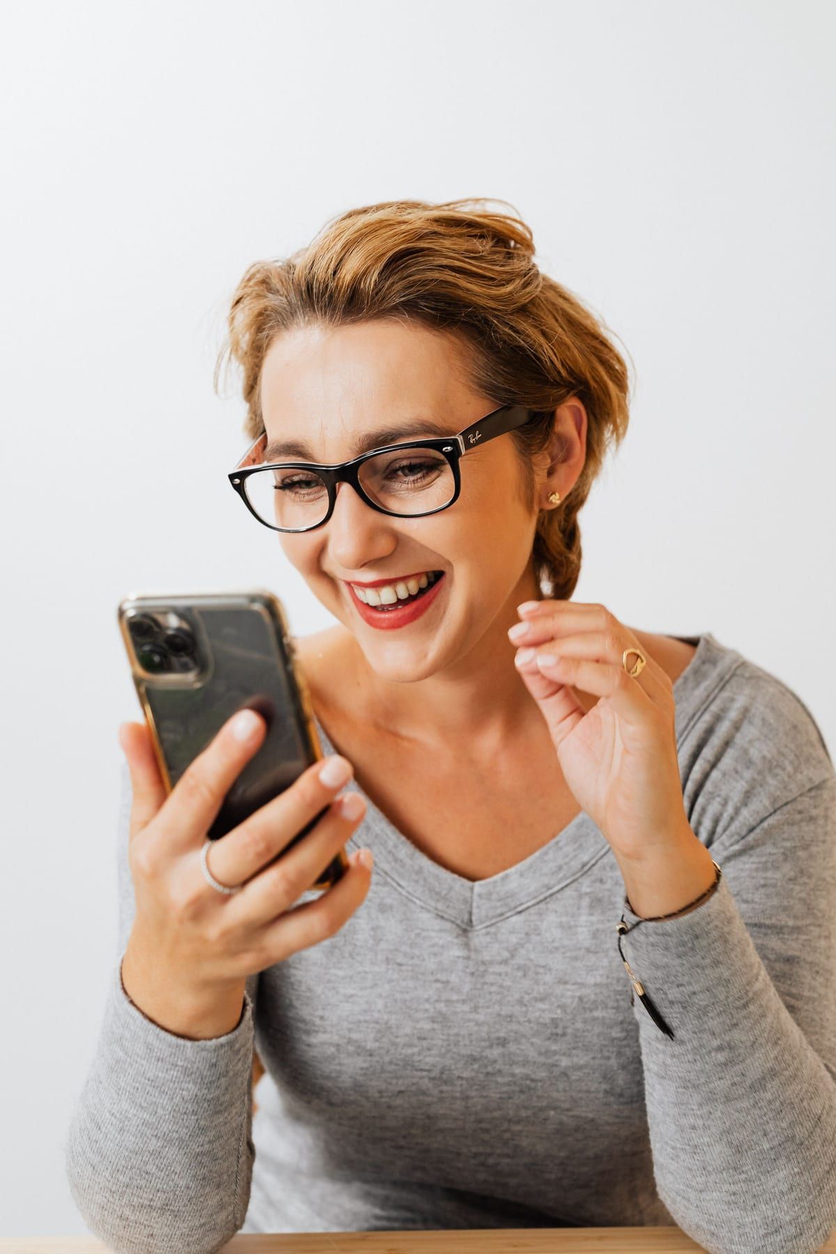 A shopper looking at a loyalty rewards screen on her phone