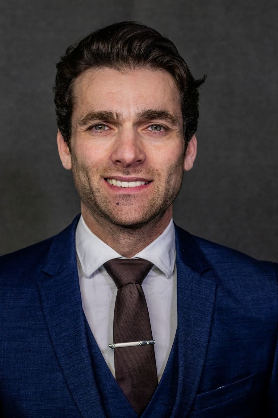 Portrait of a retail technology executive, representing the CIO and CTO