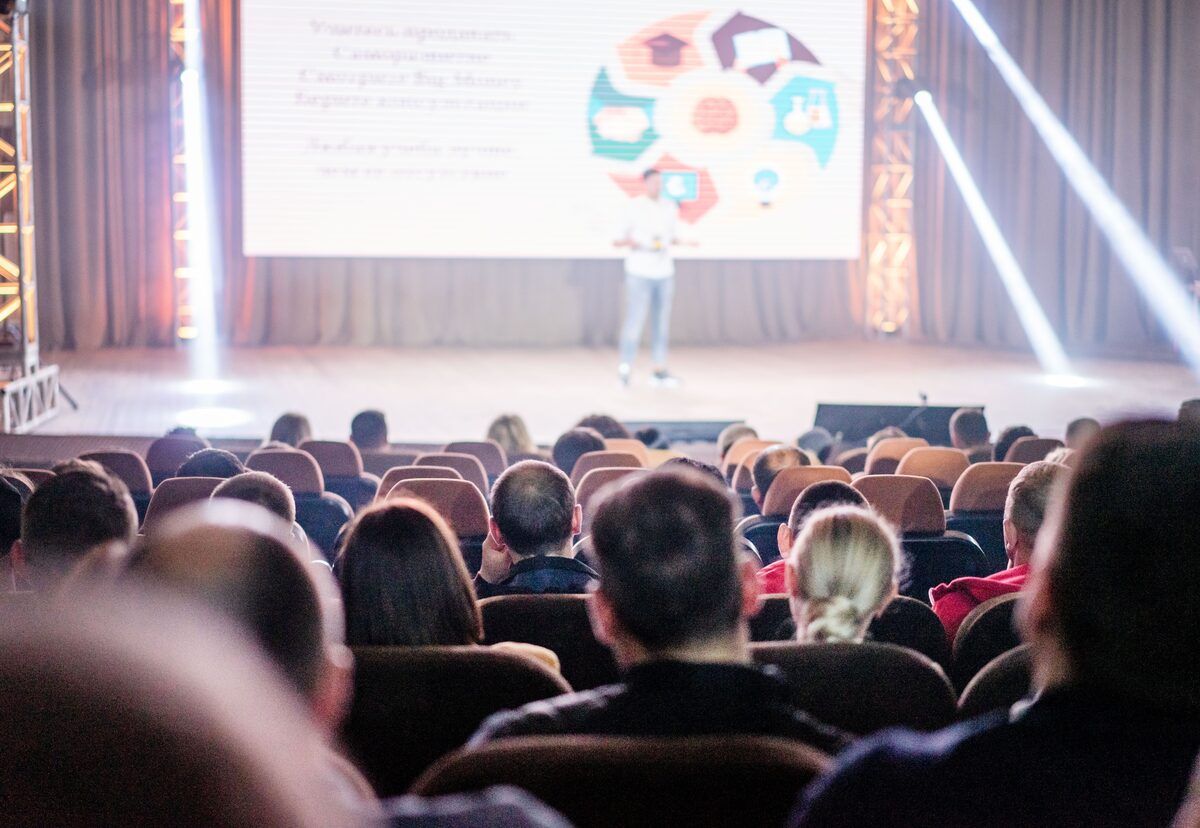 Attendees on the floor of a business event