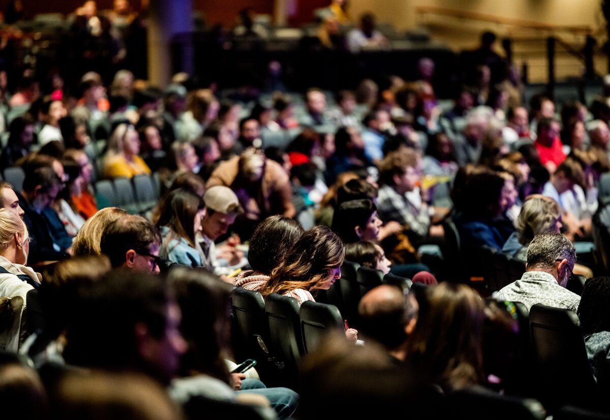 An attendee checking an event app on a phone