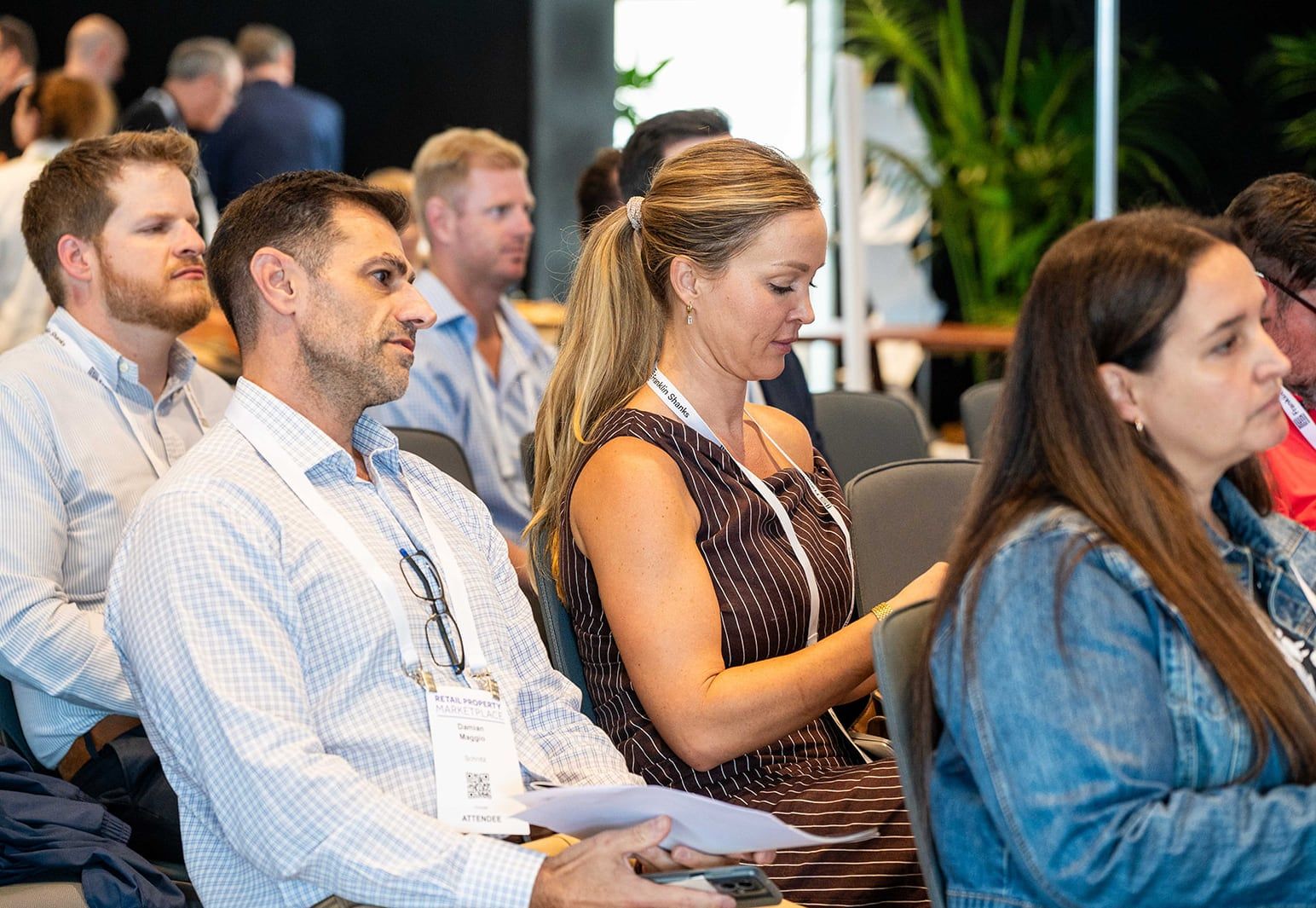 Audience members listening to a session in the conference area
