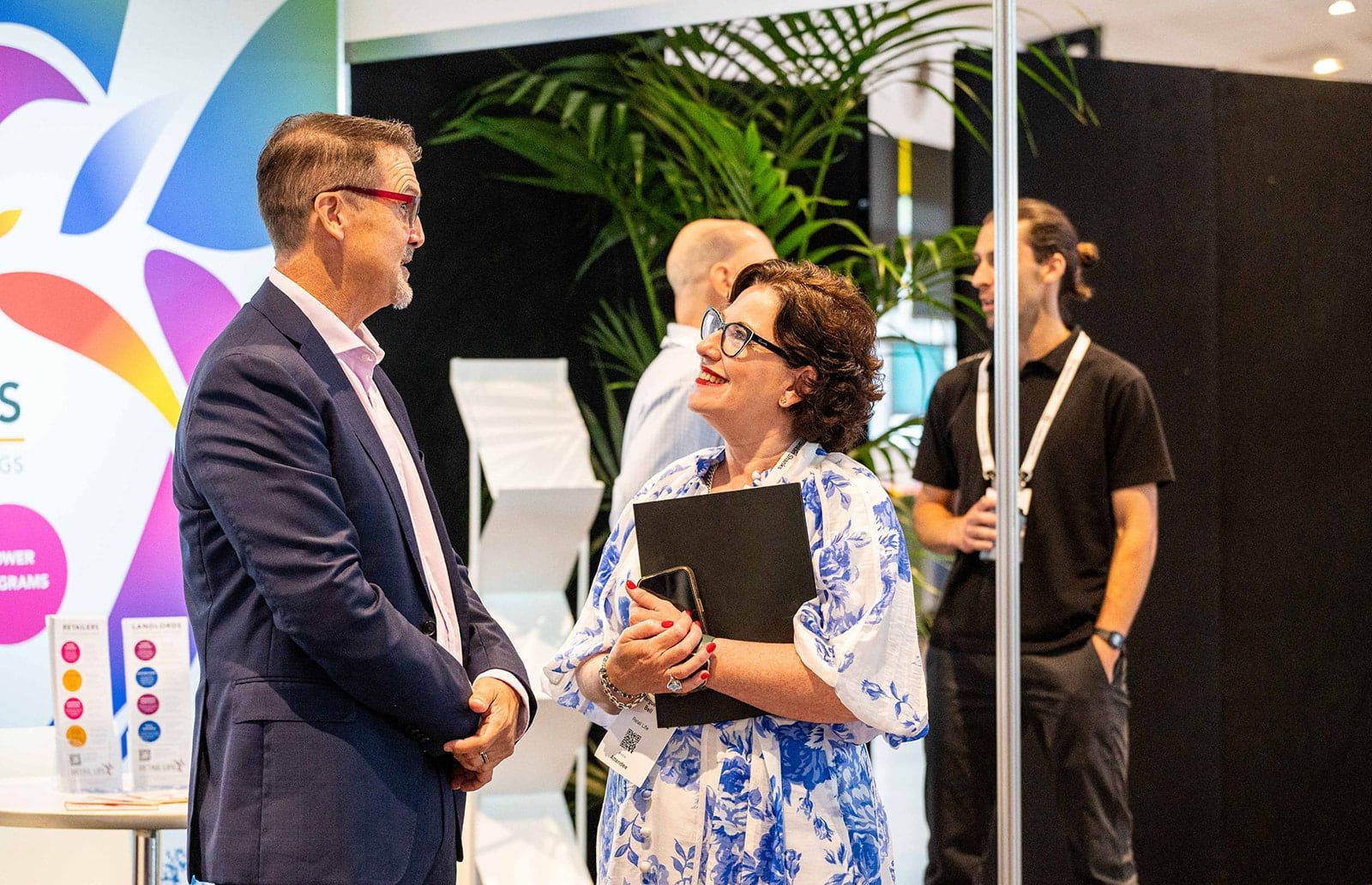 Visitors gathered around a native flower display and grazing platter at the networking drinks